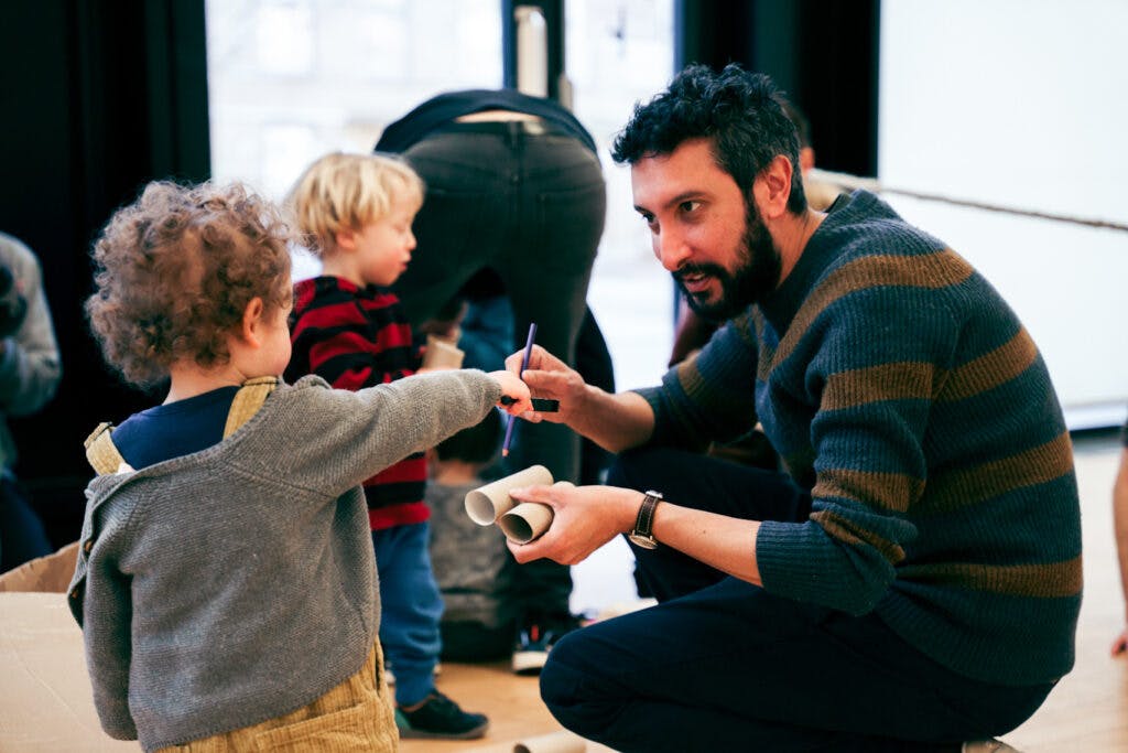 A dad playing with his young son at an event by LEAP partner Young Titans.